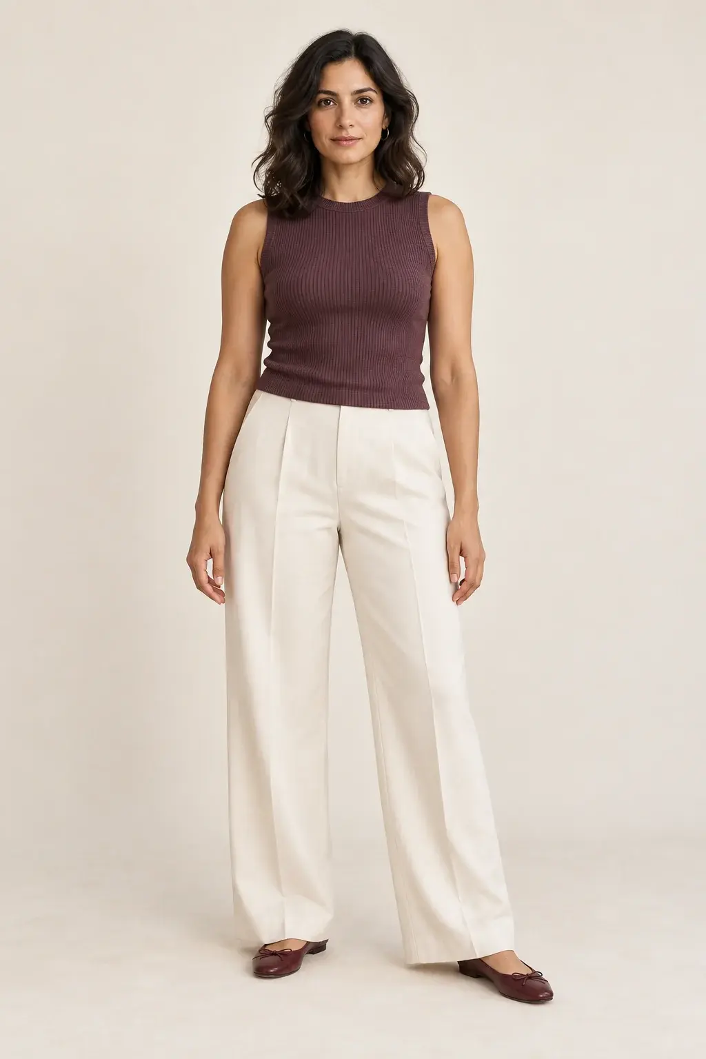 Outfit inspiration with a plum sleeveless top and ivory wide-leg trousers